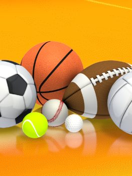 Différents types de ballons de sport : football, basketball, tennis et rugby.